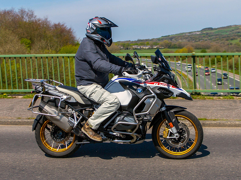 Guy riding BMW GS wearing adventure helmet